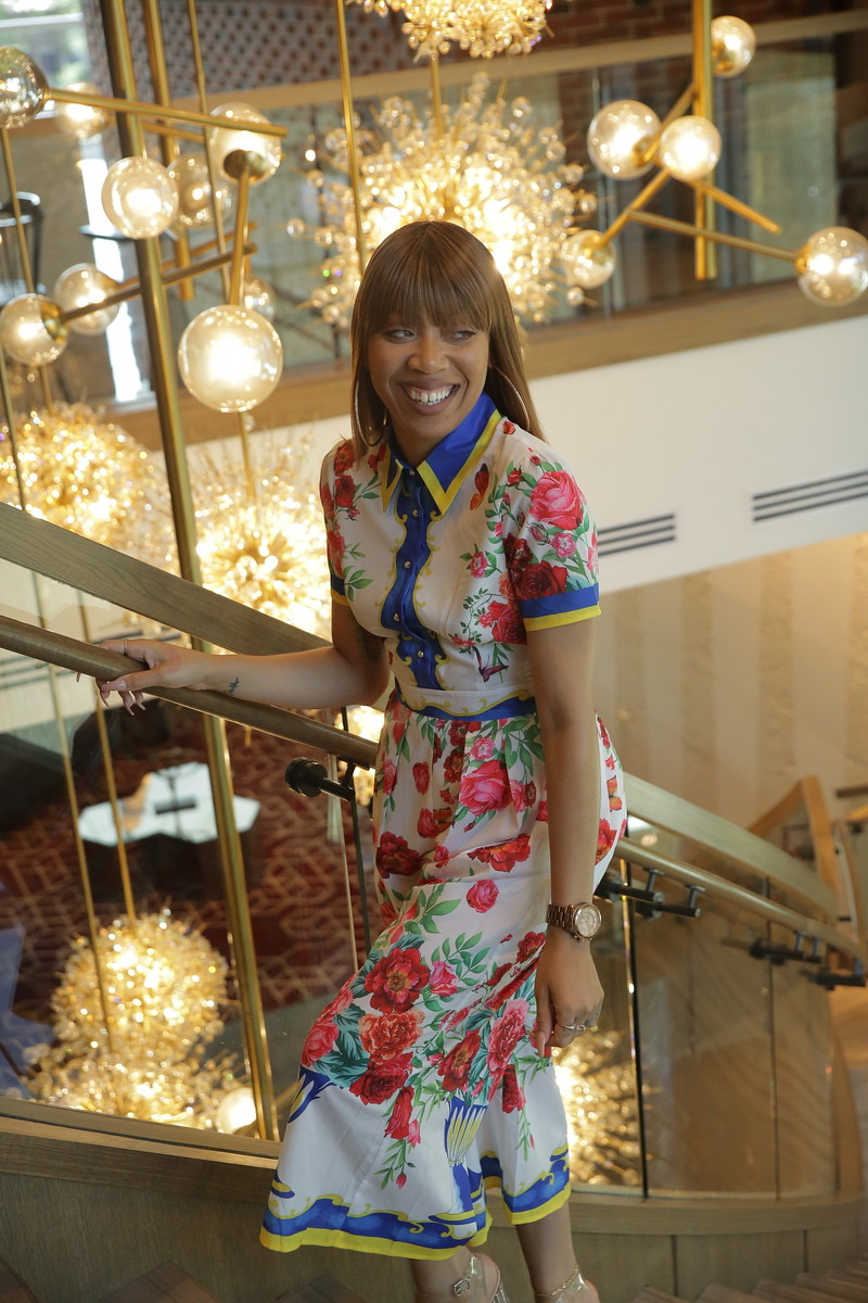Royal Bleau model in a floral dress